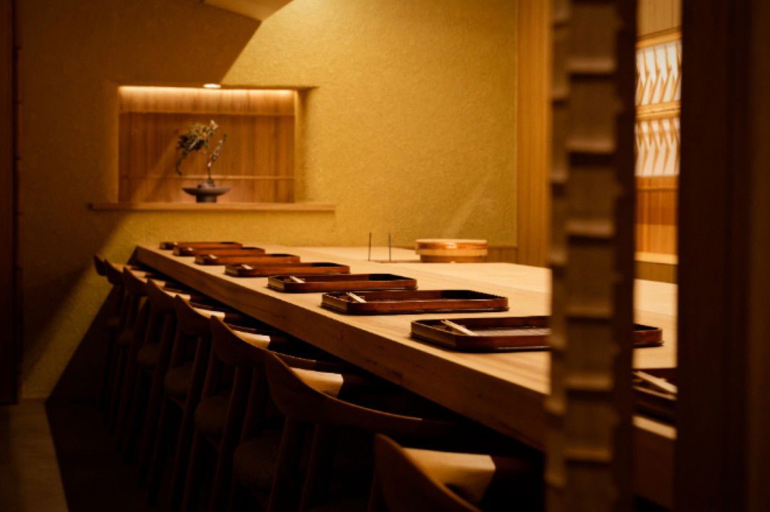Elegant Japanese dining area with wooden decor and place settings