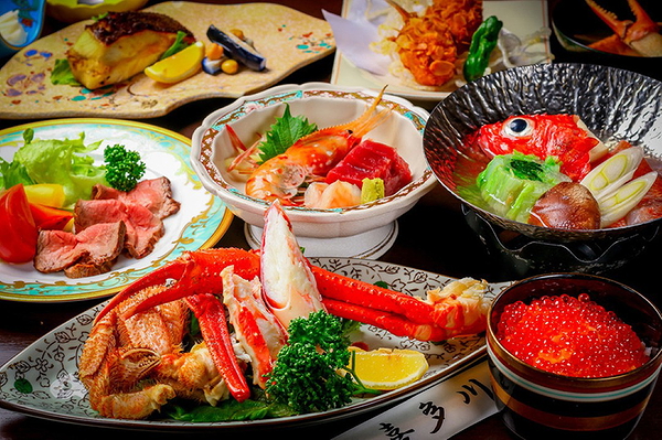 Gourmet seafood platter with crab legs and assorted sashimi