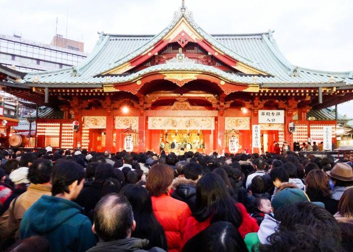 A huge crowd of people queuing for hatsumode at a local shrine