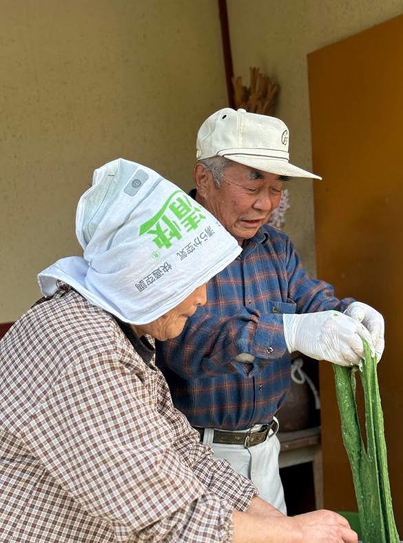 Elderly couple engaged in traditional craft making