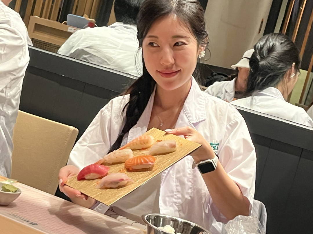 Woman enjoying a sushi tasting experience