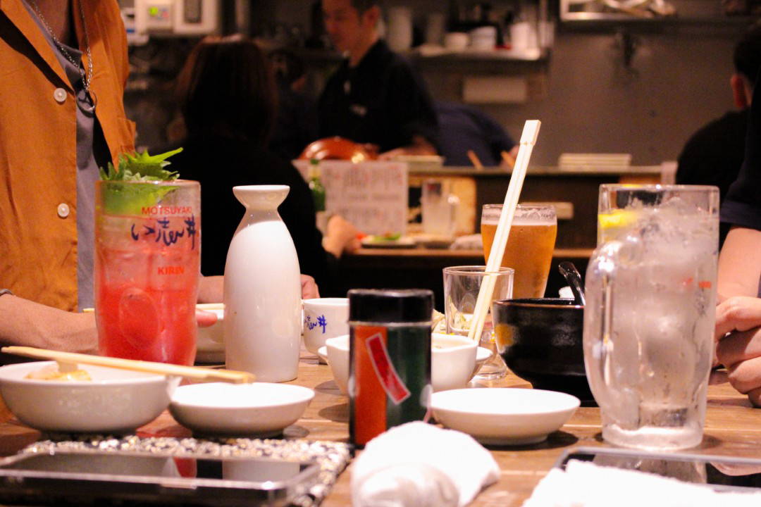 Authentic Japanese izakaya dining experience at a lively bar