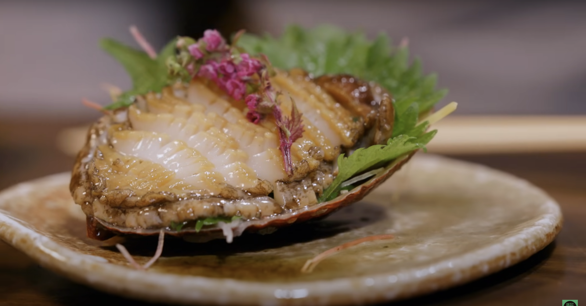 Gourmet abalone dish with elegant seafood presentation