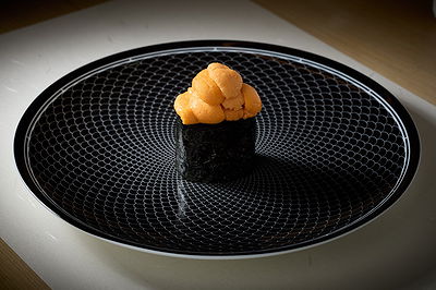 Elegant sea urchin sushi on a geometric-patterned plate