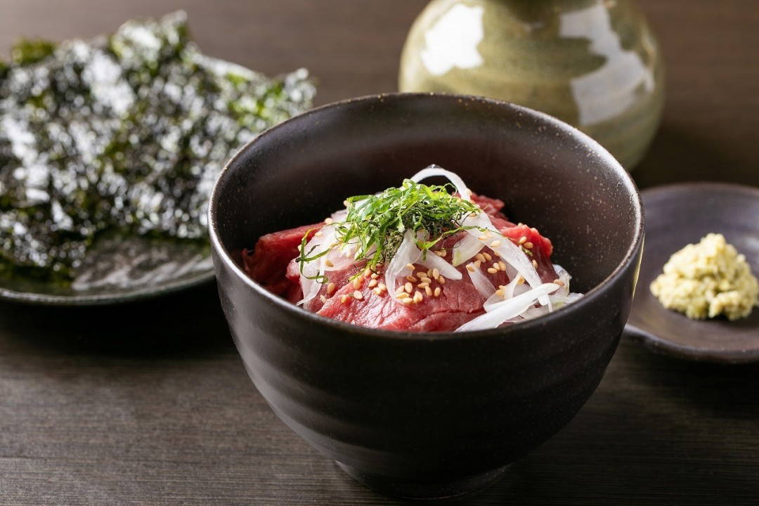 Delicious Japanese beef bowl with seaweed and wasabi on the side