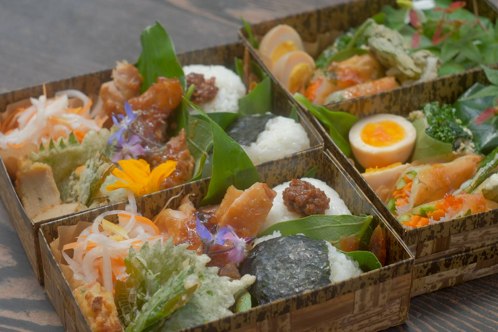 Exquisite Japanese bento boxes with assorted traditional ingredients