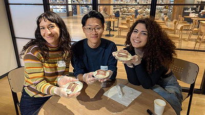 Friends enjoying a pastry workshop together at a cozy bakery.