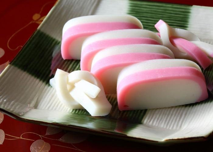 Pink and white half-moon shaped kamaboko fish cake for the Japanese New Year