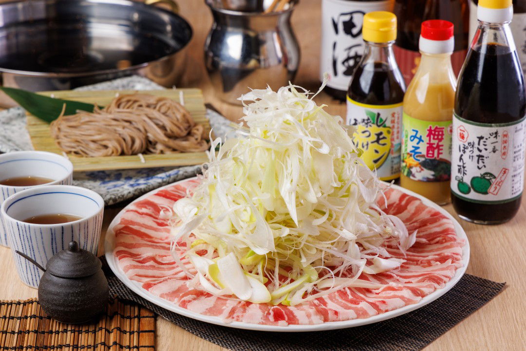 Traditional Japanese hot pot ingredients with sauces