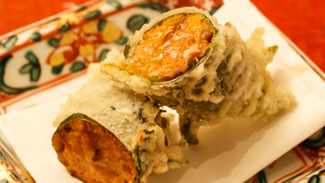 Gourmet vegetable tempura served on decorative plate