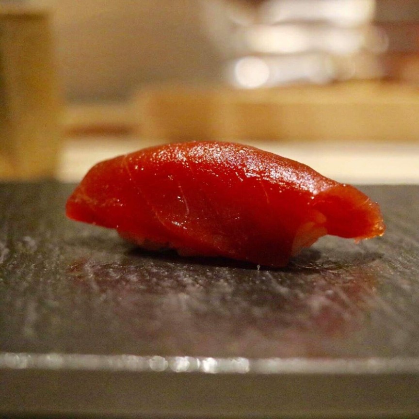 Close-up of fresh tuna sushi at gourmet Japanese restaurant.