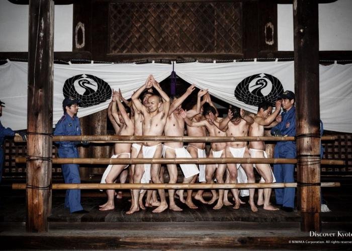 Naked men are dancing merrily on stage in the cold winter night