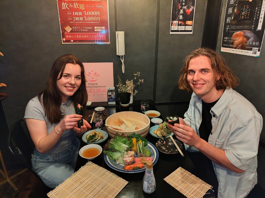 Couple enjoys traditional Japanese kaiseki meal in cozy restaurant