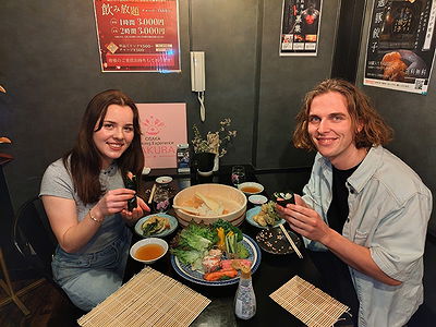 Couple enjoys traditional Japanese kaiseki meal in cozy restaurant