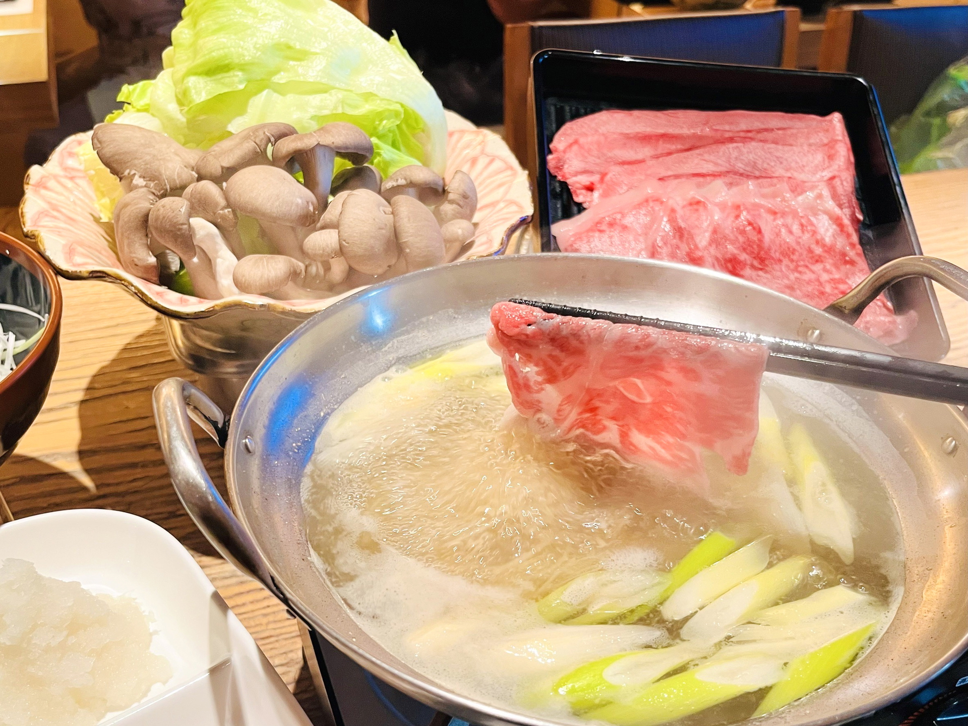 Delicious shabu shabu with fresh vegetables and thinly sliced beef.