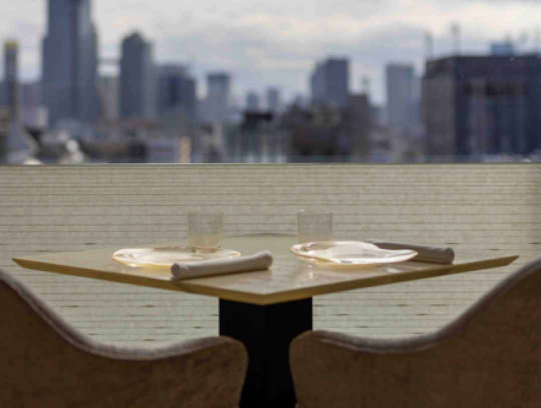 Gourmet city view dining setup with elegant place settings