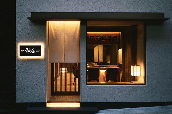 Elegant restaurant entrance with warm lighting and inviting ambiance