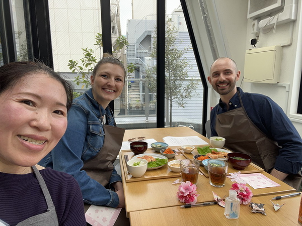 Group cooking class enjoying traditional Korean dishes