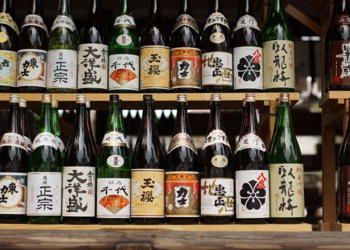 Sake bottles lines up on a shelf