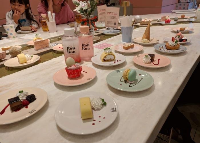Colorful desserts on table.
