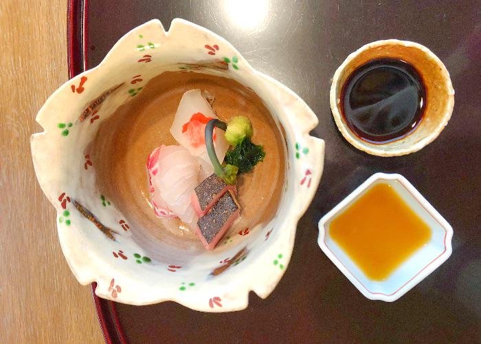 A beautiful sakura-shaped dish containing sashimi from Komago, a 3-star Michelin Restaurant in Hyogo