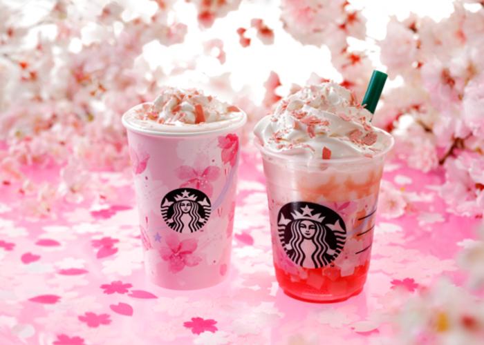 Promotional image for Starbucks Sakura Latte and Frappuccino in Japan, with two drinks against a backdrop of cherry blossom petals