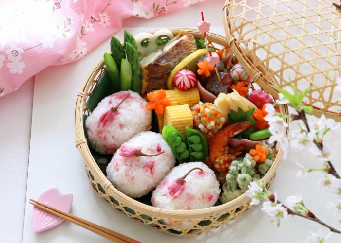 Sakura onigiri bento box, made with sakura featuring pickled cherry blossoms