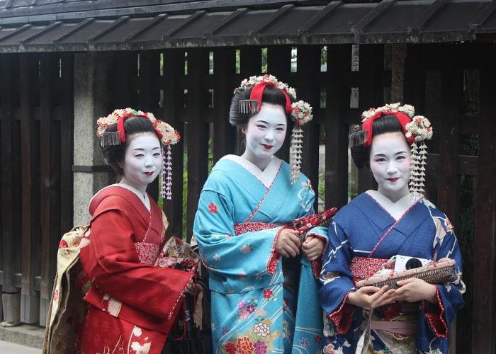 Geisha dressed in colorful kimono