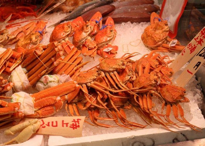 Big crabs and other shellfish on ice for sale