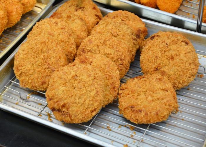 Menchi Katsu, fried Japanese food, on a cooling rack