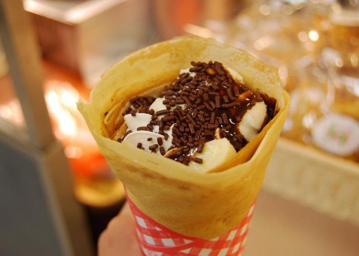 Japanese-style crepe with whipped cream and chocolate sprinkles 