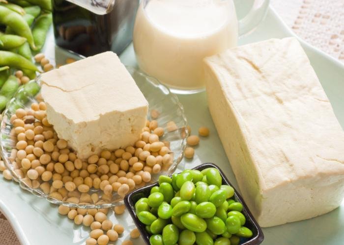 A spread of tofu and soybeans - both green edamame and white soybeans