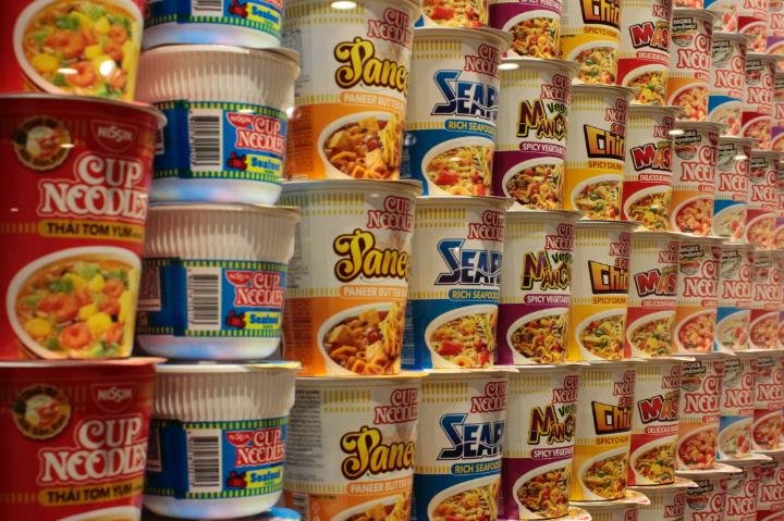 A long wall of Cup Noodles featuring seafood noodles and chicken Cup Noodles