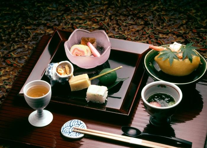 Kaiseki Ryori, the traditional Japanese banquet-style meal. A tray holding a variety of seasonal Japanese dishes