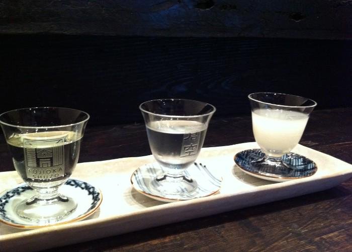 3 glass sake cups filled with nihonshu from Fujioka Shuzo
