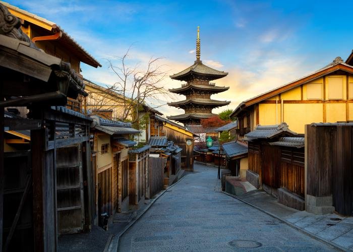 Street in Higashiyama, Kyoto, with traditional architecture and blue skies