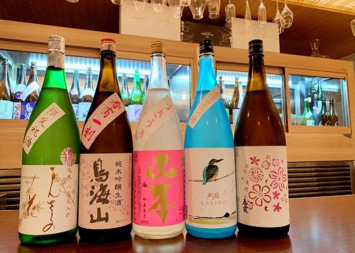 Line-up of sake bottles at Akita Pure Rice Sake Bar