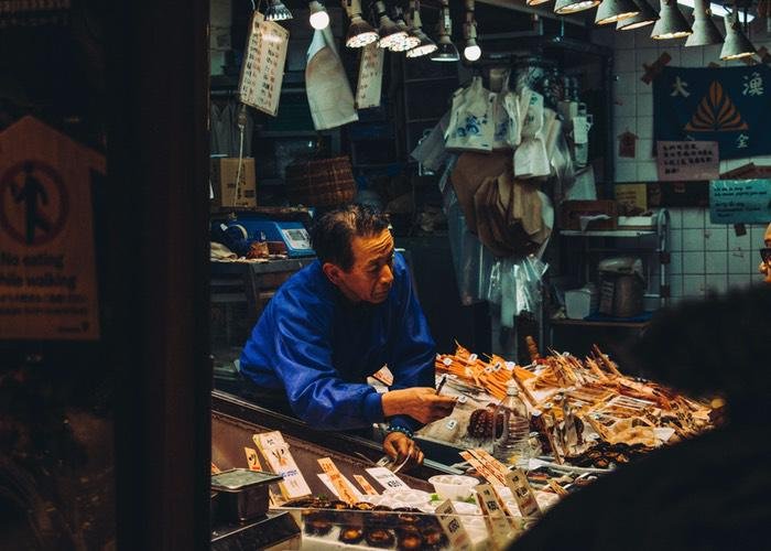 A picture of a seller at Nishiki Market in Kyoto