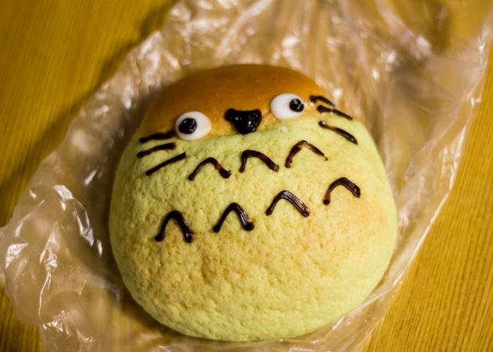 This melon pan looks like Totoro, a famous Ghibli character. There are whiskers and eyes and chocolate drizzle was used to form it. 