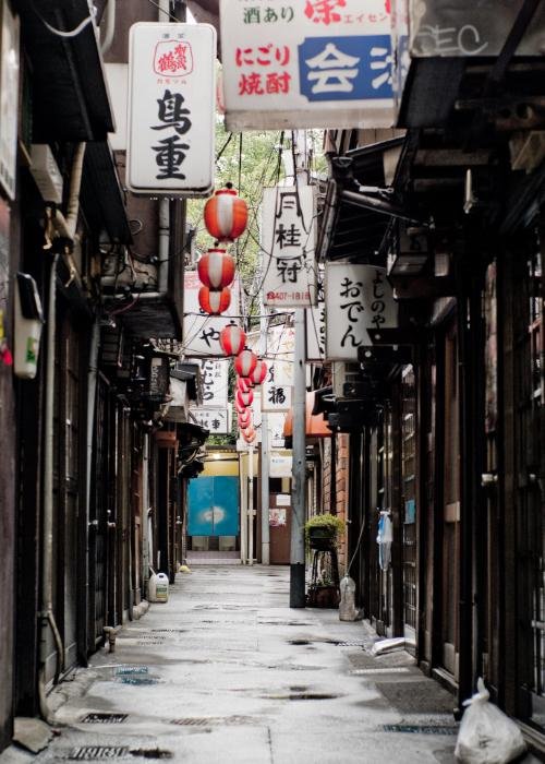 Tokyo's Nonbei Yokocho, a drinking alley during the daytime with various signs in Japanese