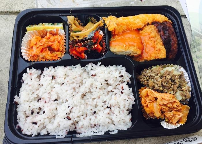 Bento from konbini with rice and other colorful vegetable dishes