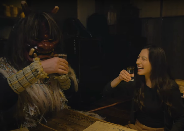 Shizuka Anderson drinks Japanese sake with a Namahage demon at the Akita Namahage Restaurant 