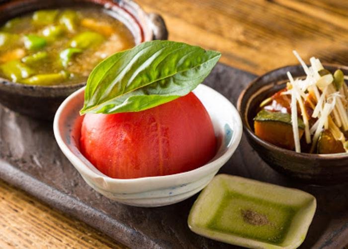 Tomato dish and kabocha Japanese pumpkin dish at Onikai, an izakaya in Kyoto
