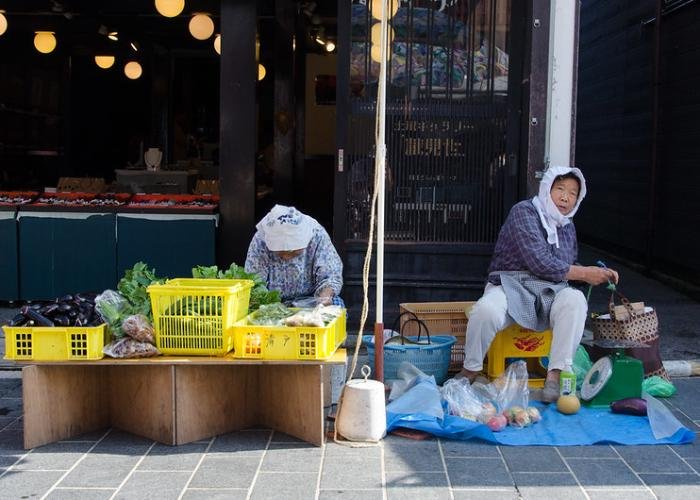 Two women selling vegetables at Wajima Asaichi Morning Market in Sendai