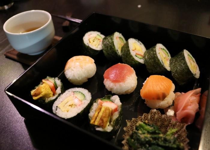 Bento box filled with a variety of sushi rolls during a Japanese Sushi Making Class in KYoto