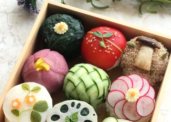 9 types of sushi in a bento beautifully decorated with vegetables during the Kawaii Vegetarian Sushi Cooking Class in Tokyo