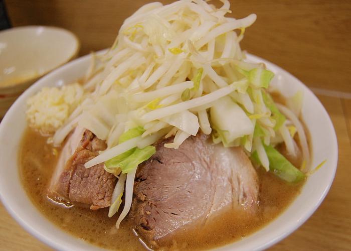 A bowl of Ramen Jiro junk food ramen with extra chashu