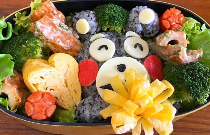 Bento with a cute black bear made of rice