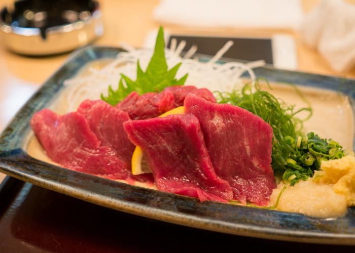 Close up image of horse meat sashimi