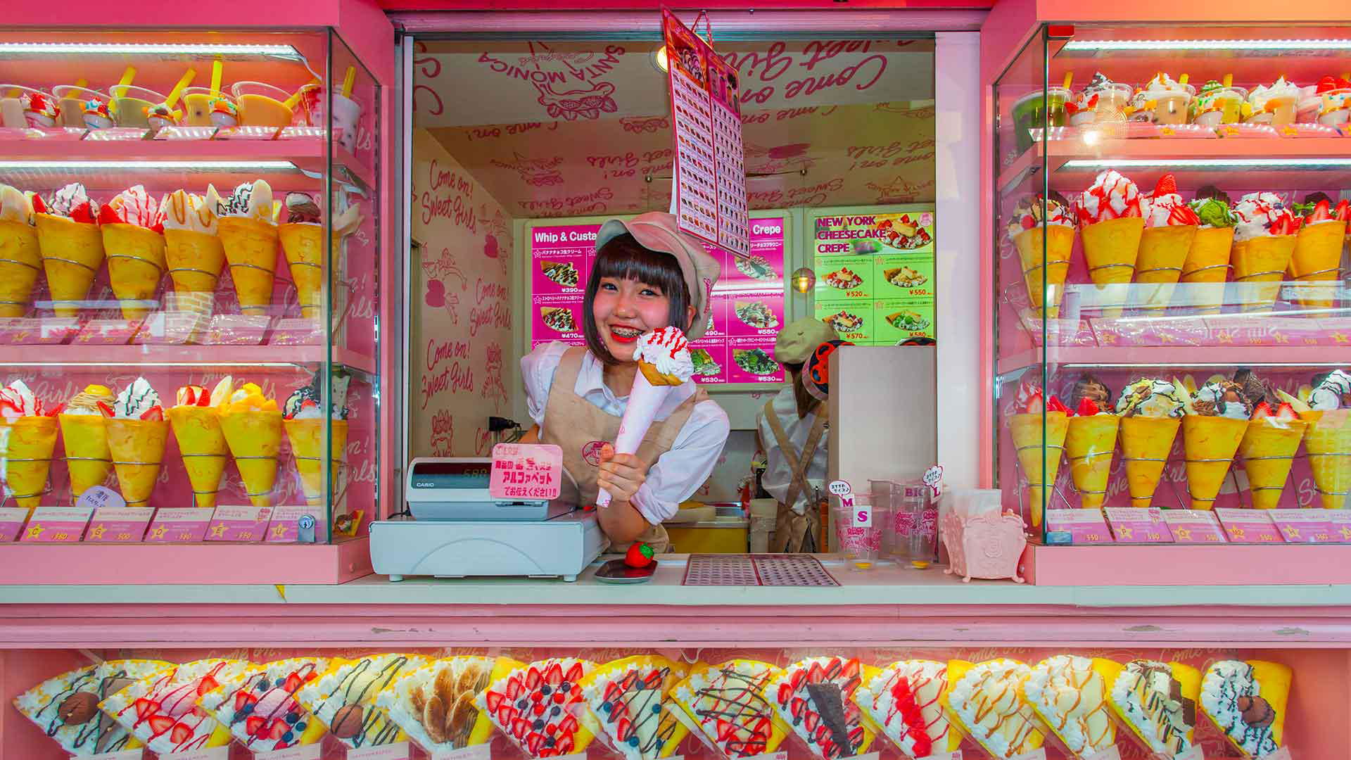 Colorful crepe shop with cheerful vendor in vibrant pink setting
